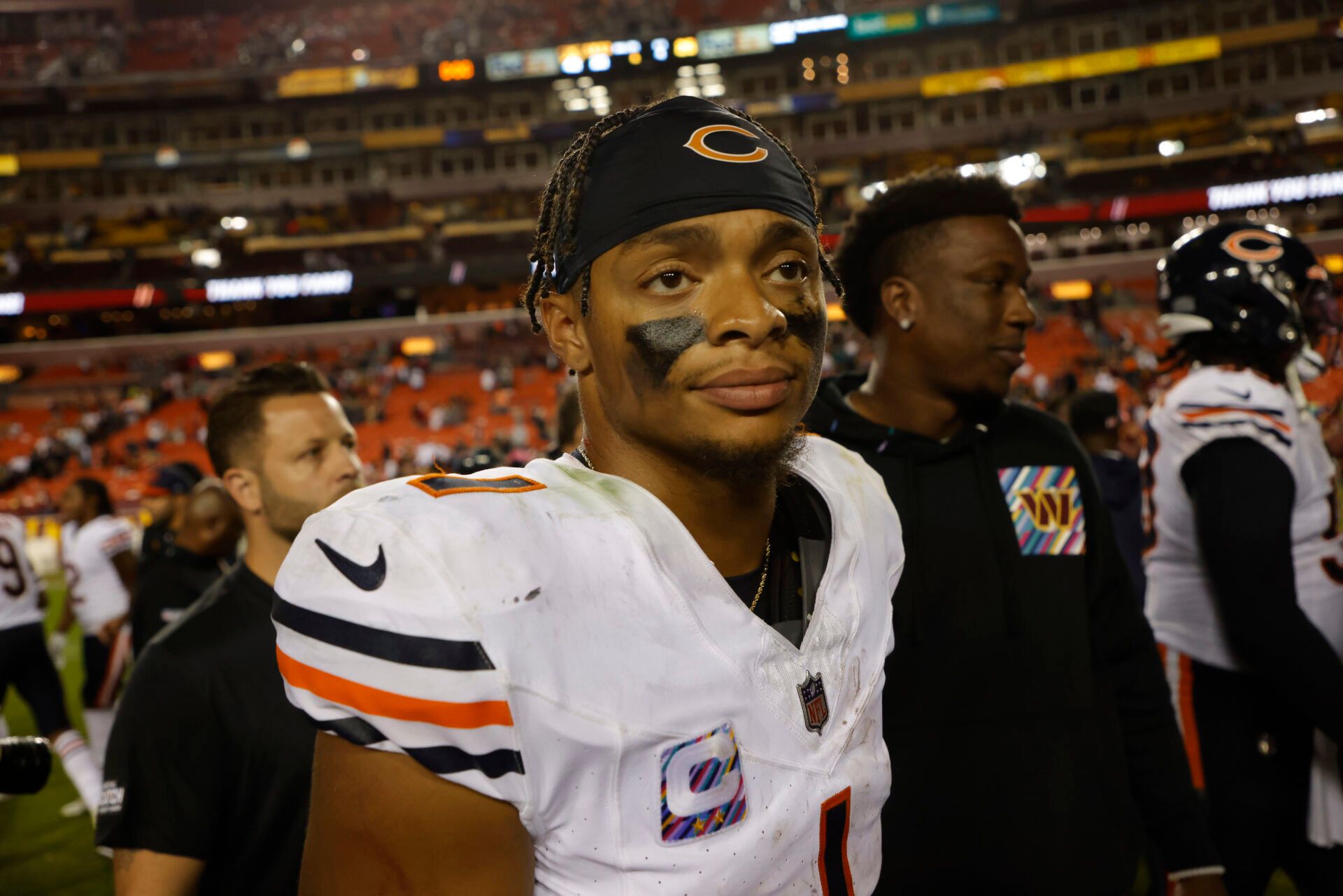 Chicago Bears quarterback Justin Fields (1) walks off the field after the Bears' game against the Washington Commanders at FedExField.