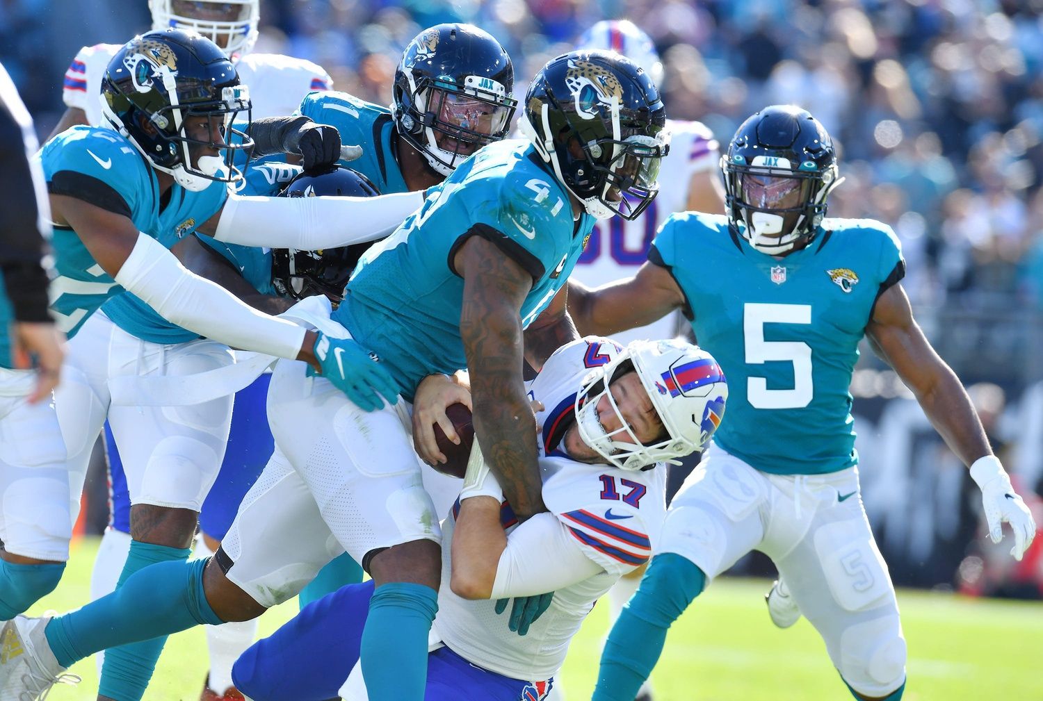 Jacksonville Jaguars linebacker Josh Allen (41) makes a second-quarter sack on Buffalo Bills quarterback Josh Allen (17).