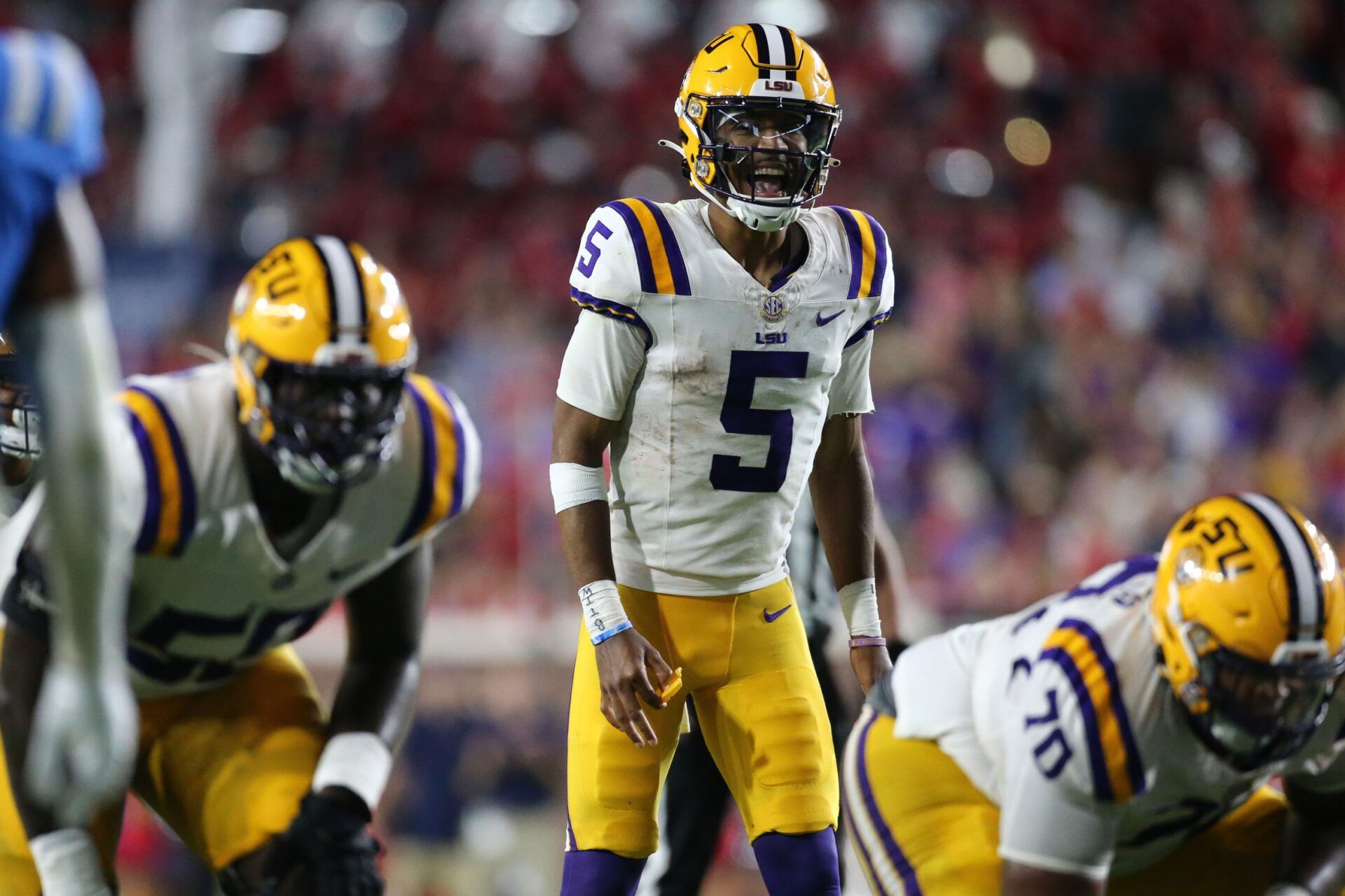 Jayden Daniels (5) give direction prior to the snap during the second half against the Mississippi Rebels at Vaught-Hemingway Stadium.