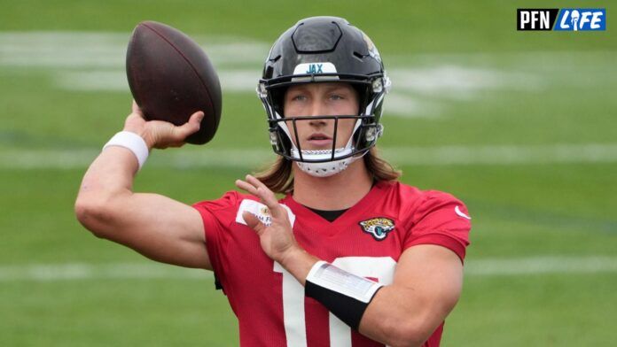 Trevor Lawrence (16) throws the ball during practice at Hanbury Manor Marriott.