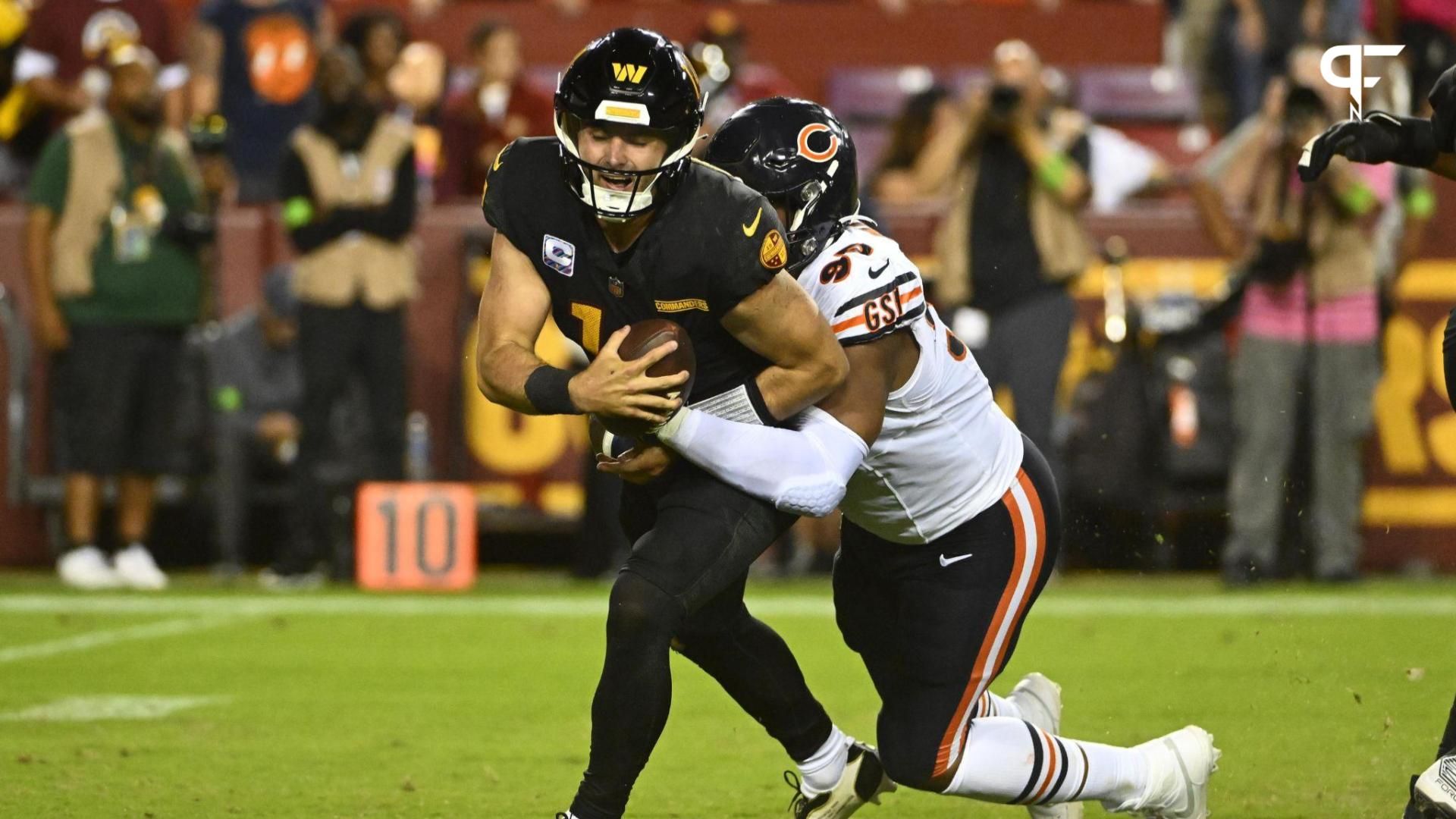 Chicago Bears defensive end DeMarcus Walker (95) sacks Washington Commanders quarterback Sam Howell (14) during the second half at FedExField.