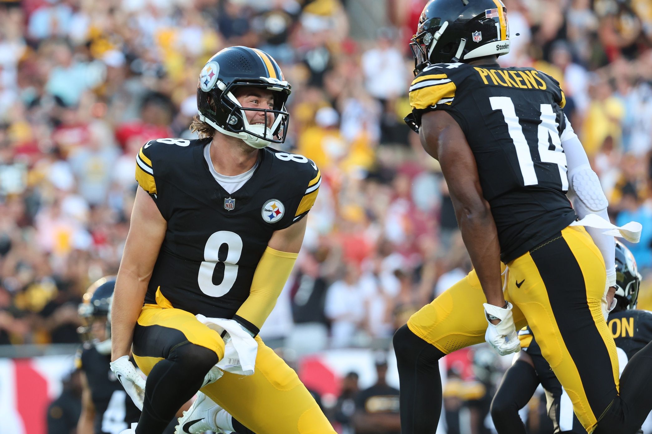 George Pickens (14) celebrates with quarterback Kenny Pickett (8) after scoring a touchdown against the Tampa Bay Buccaneers during the first quarter at Raymond James Stadium.
