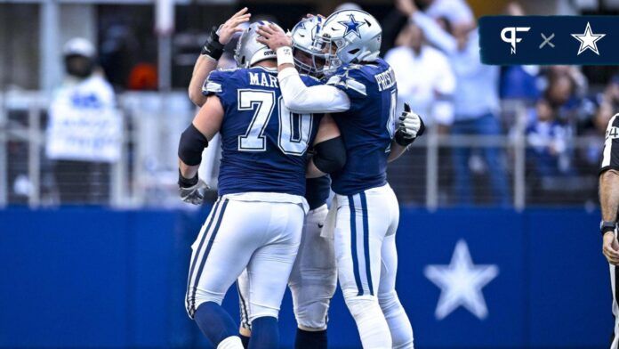 Dallas Cowboys quarterback Dak Prescott (4) and guard Zack Martin (70) celebrates a touchdown scored by running back Tony Pollard (not pictured) during the second half against the Chicago Bears at AT&T Stadium.