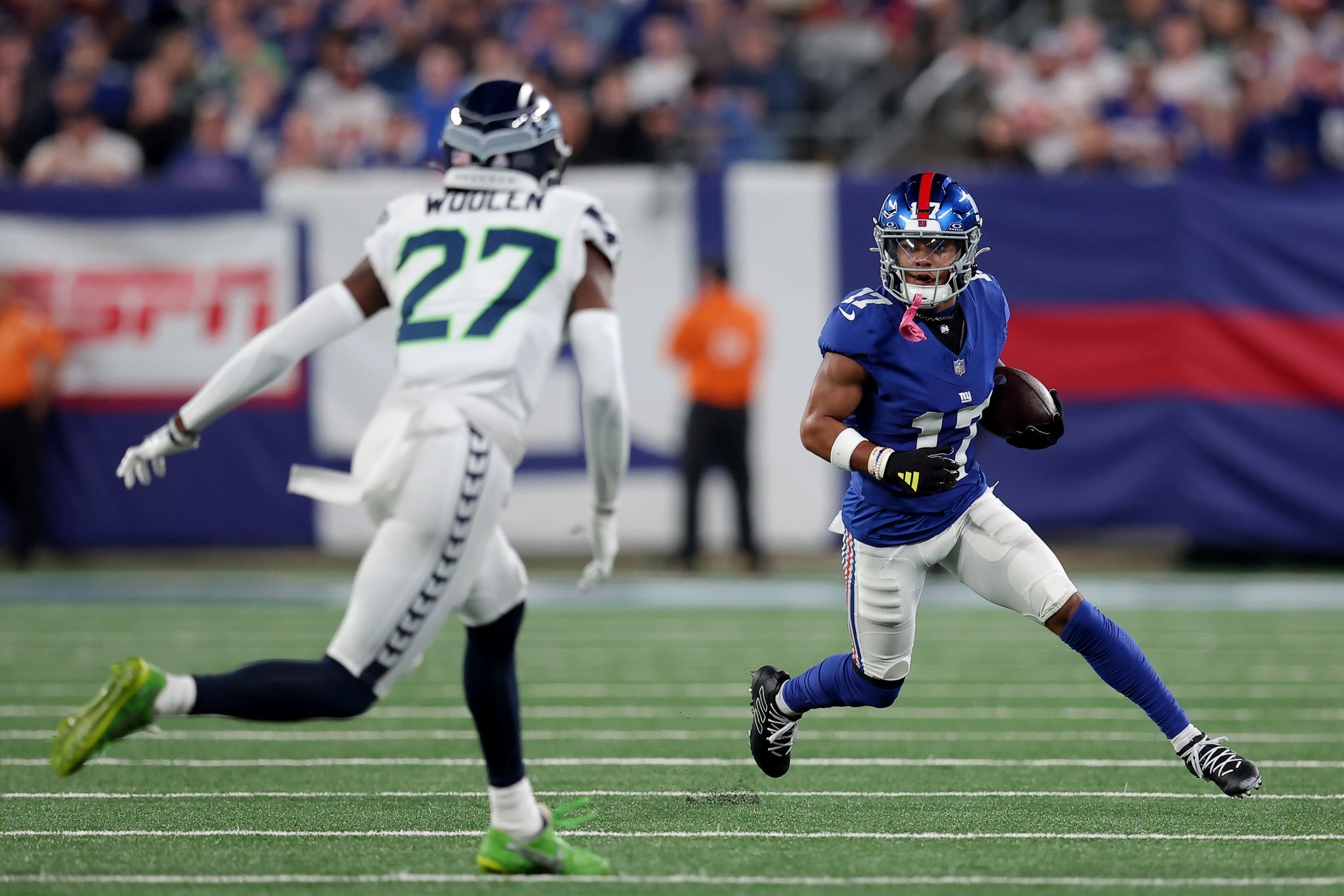 Wan'Dale Robinson (17) runs with the ball against Seattle Seahawks cornerback Riq Woolen (27) during the first quarter at MetLife Stadium.
