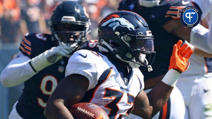 Denver Broncos running back Javonte Williams (33) rushes the ball against the Chicago Bears during the first half at Soldier Field.