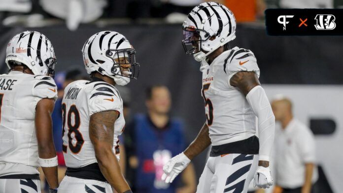 Cincinnati Bengals running back Joe Mixon (28) reacts after scoring a touchdown with wide receiver Tee Higgins (5) in the second half against the Los Angeles Rams at Paycor Stadium.