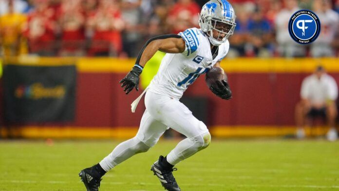 Detroit Lions wide receiver Amon-Ra St. Brown (14) runs with the ball during the second half against the Kansas City Chiefs at GEHA Field at Arrowhead Stadium.