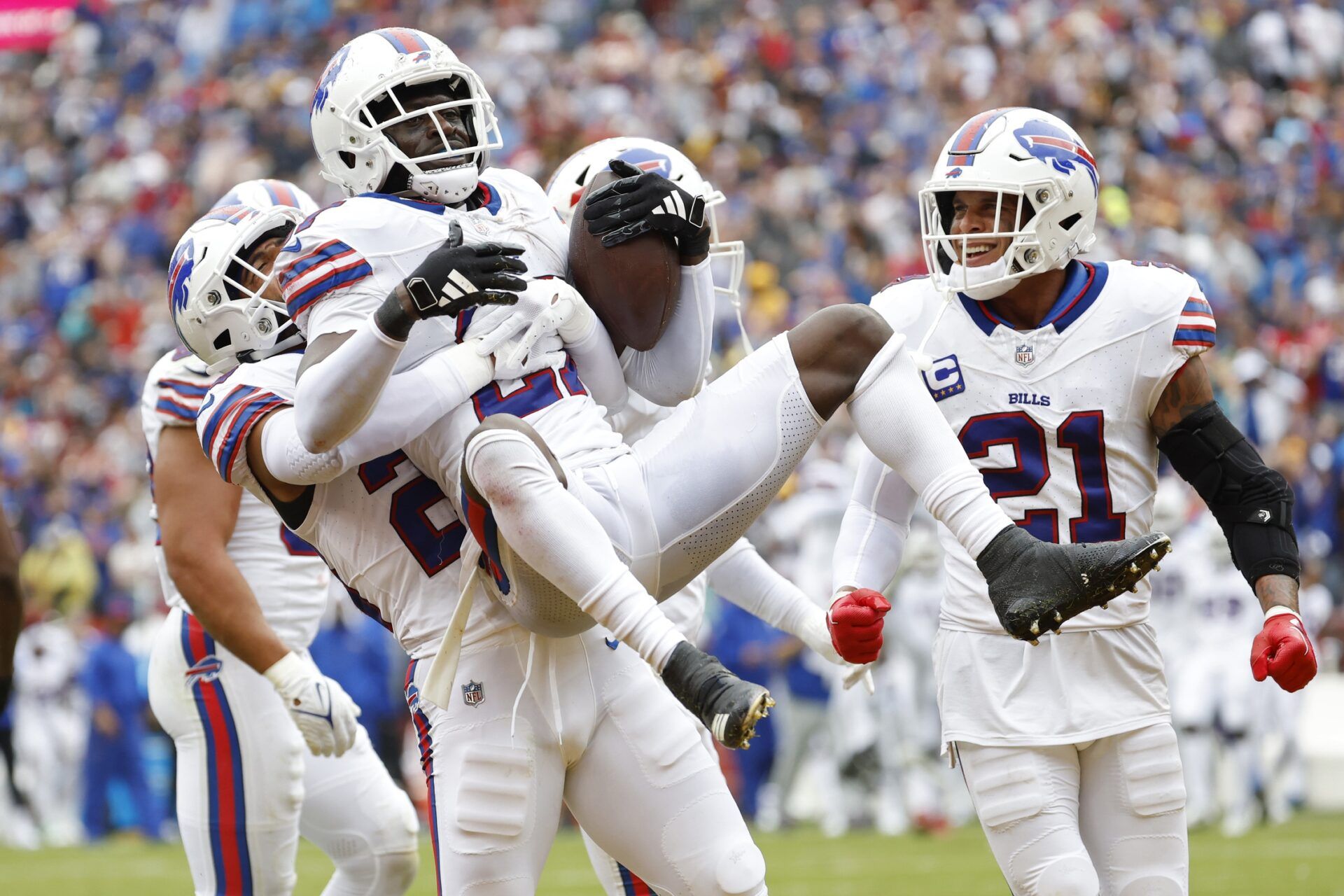 Tre'Davious White (27) celebrates with Bills safety Micah Hyde (23) after intercepting a pass in the end zone against the Washington Commanders during the third quarter at FedExField.