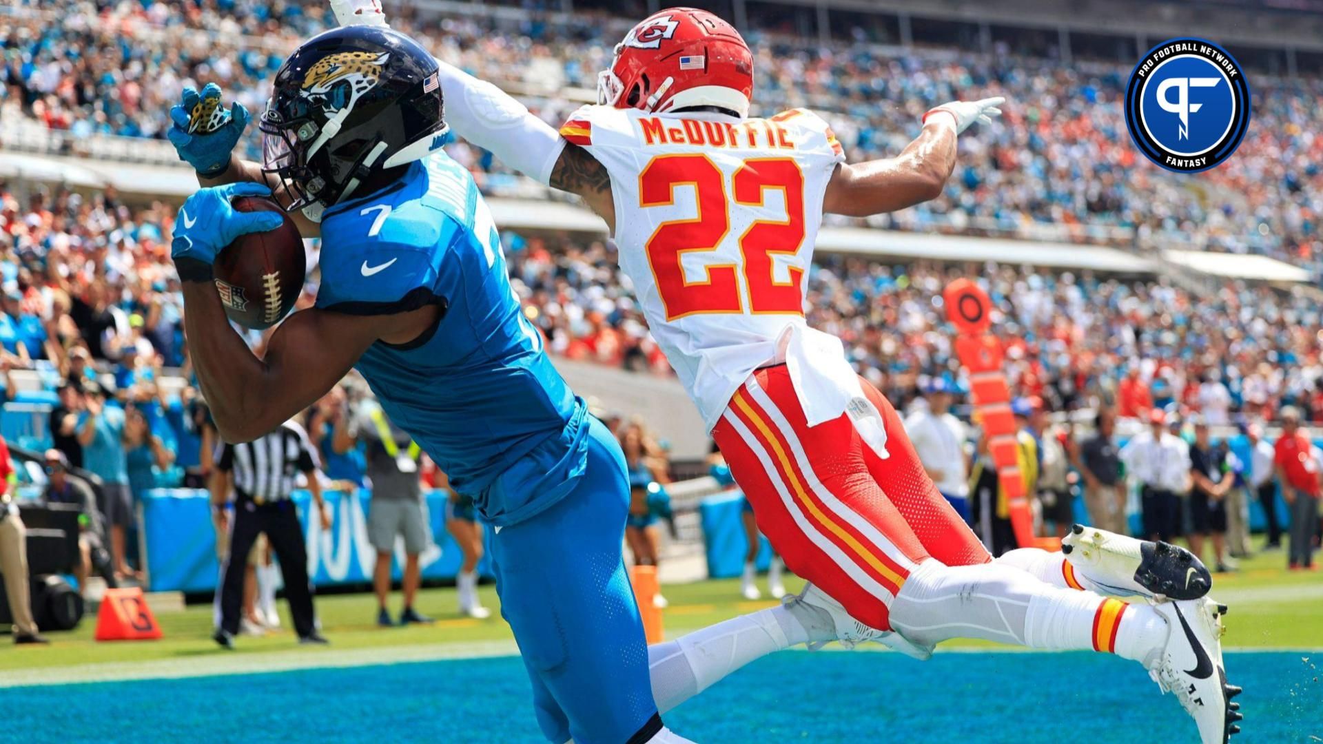 Jacksonville Jaguars wide receiver Zay Jones (7) catches a pass but can t get his second foot inbounds as Kansas City Chiefs cornerback Trent McDuffie (22) pressures during the second quarter of a NFL football game.