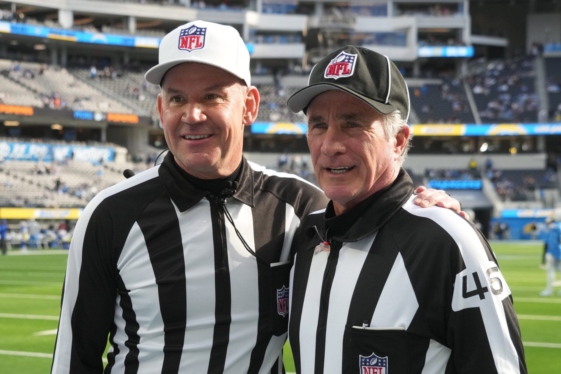 Clete Blakeman (34) and field judge Terry Brown (43) pose during the game between the Los Angeles Chargers and the Los Angeles Rams at SoFi Stadium.