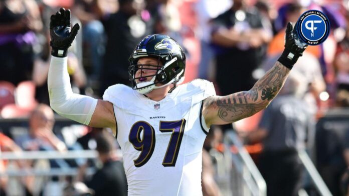 Baltimore Ravens defensive end Brent Urban (97) celebrates during the second half against the Cleveland Browns at Cleveland Browns Stadium.