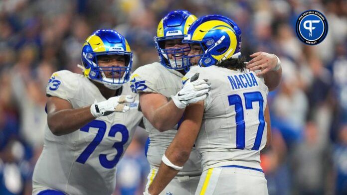 The Los Angeles Rams celebrate the game-winning touchdown by wide receiver Puka Nacua (17) during overtime on Sunday, Oct. 1, 2023, at Lucas Oil Stadium in Indianapolis.