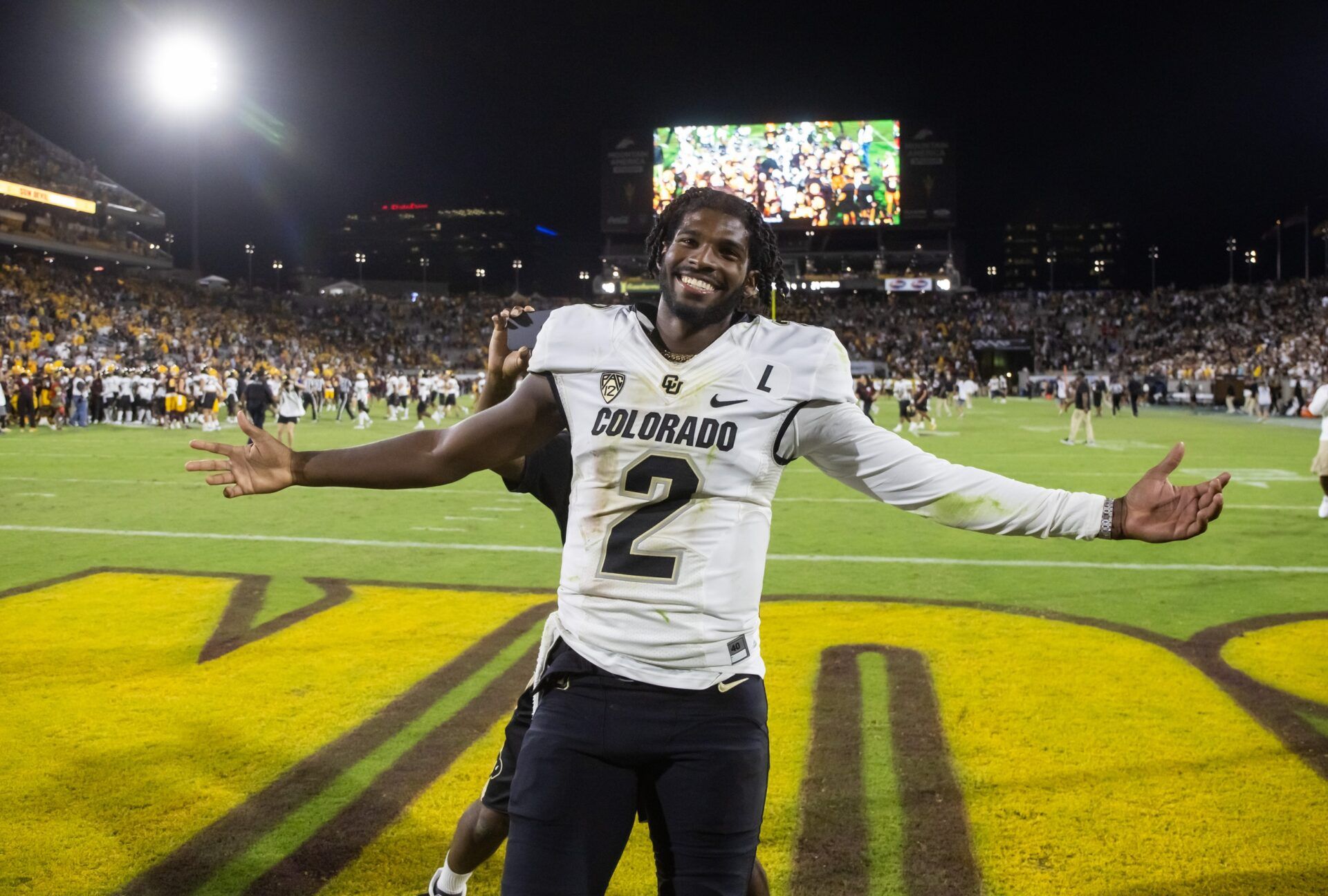 Colorado Buffaloes quarterback Shedeur Sanders (2) celebrates after defeating the Arizona State Sun Devils at Mountain America Stadium, Home of the ASU Sun Devils.