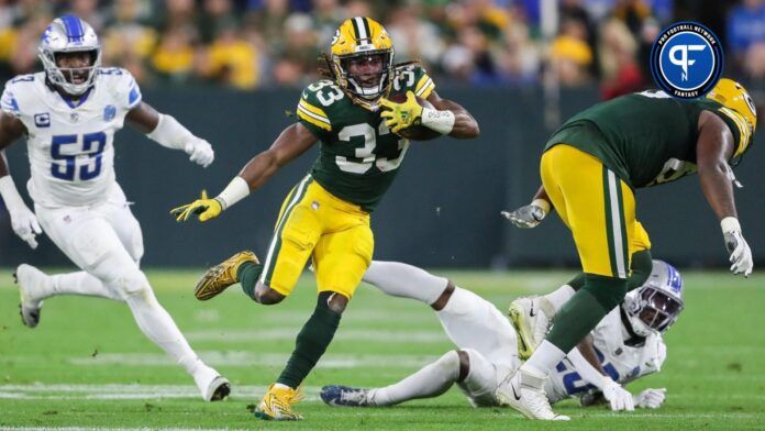 Green Bay Packers running back Aaron Jones (33) runs the ball against the Detroit Lions during their football game on Thursday, September 28, 2023, at Lambeau Field in Green Bay, Wis. The Lions won the game, 34-20.