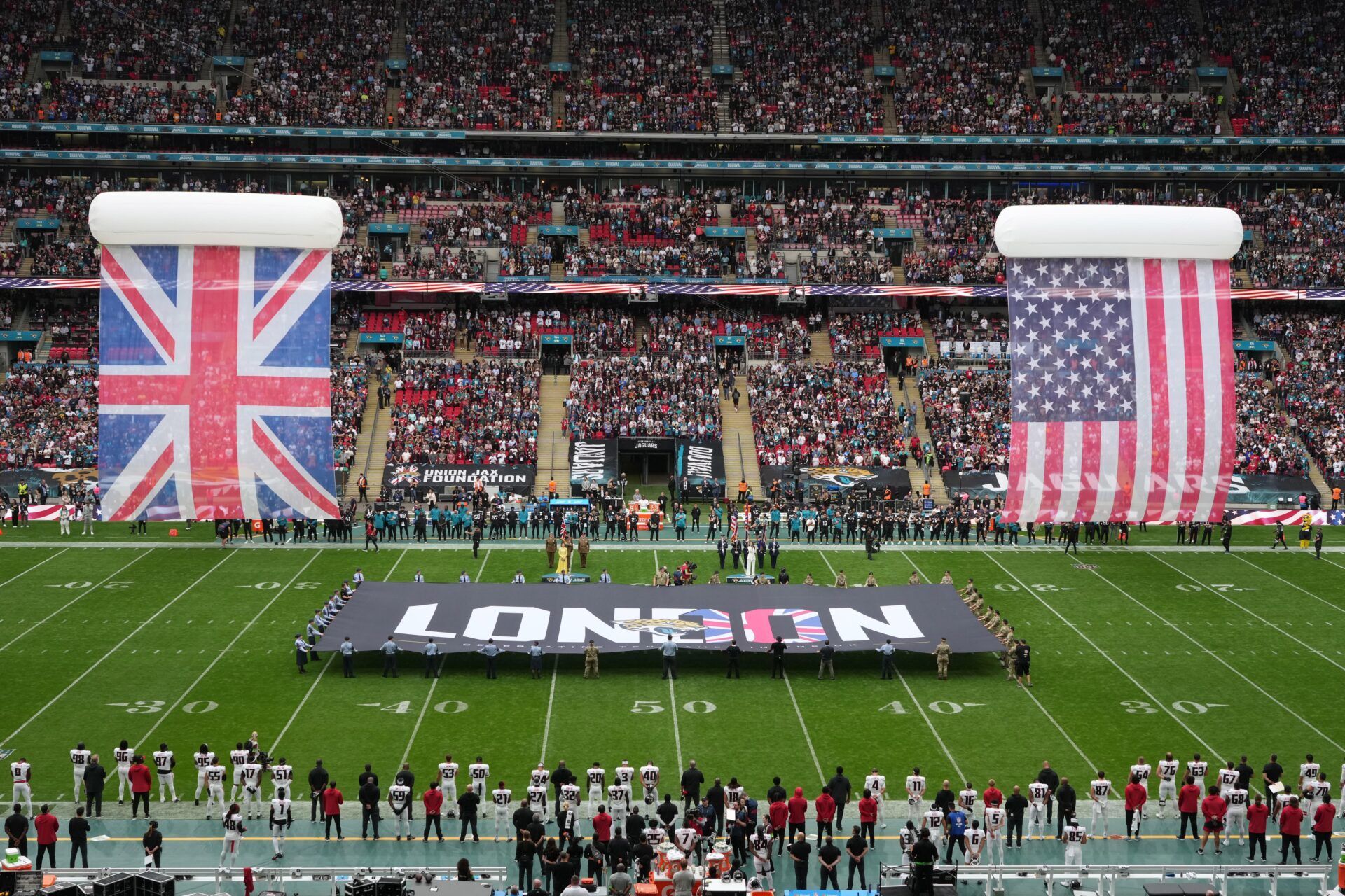 A general overall view of British and United States flags during the playing of the national anthem in an NFL International Series.