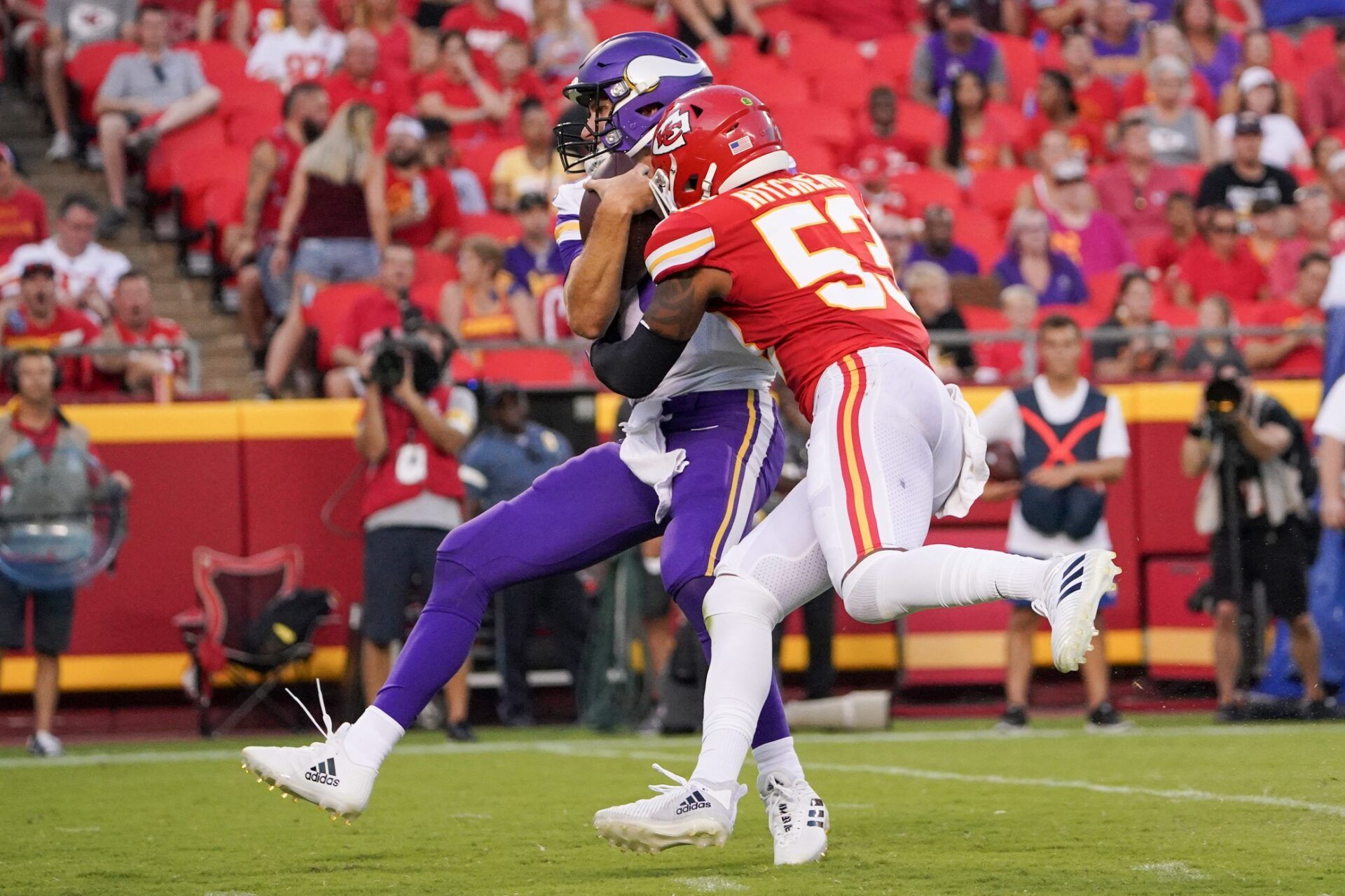 Minnesota Vikings quarterback Kirk Cousins (8) is sacked by Kansas City Chiefs inside linebacker Anthony Hitchens (53) during the first quarter at GEHA Field at Arrowhead Stadium.