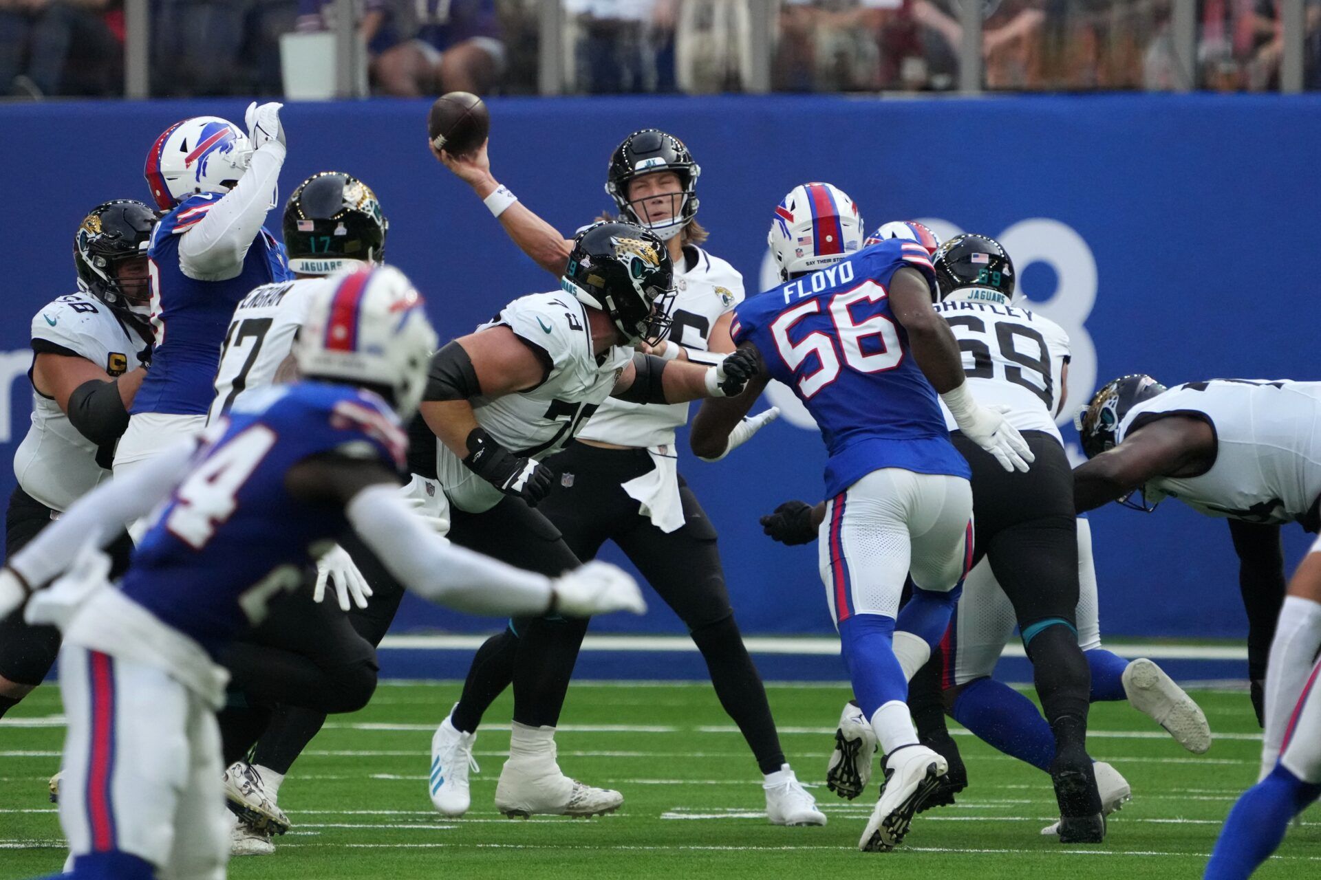 Jacksonville Jaguars QB Trevor Lawrence (16) throws the ball against the Buffalo Bills.