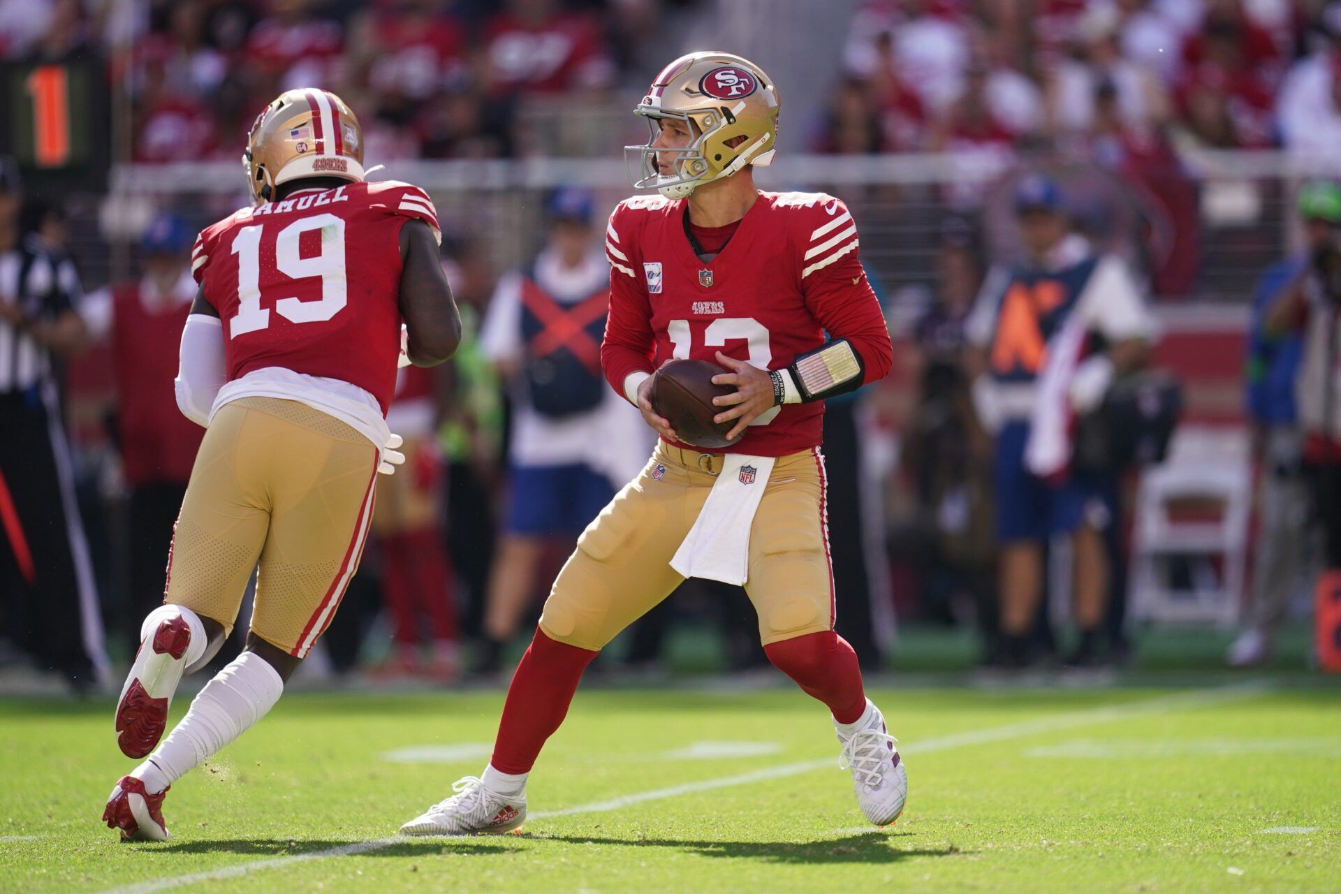 San Francisco 49ers QB Brock Purdy (13) gets set to pass.