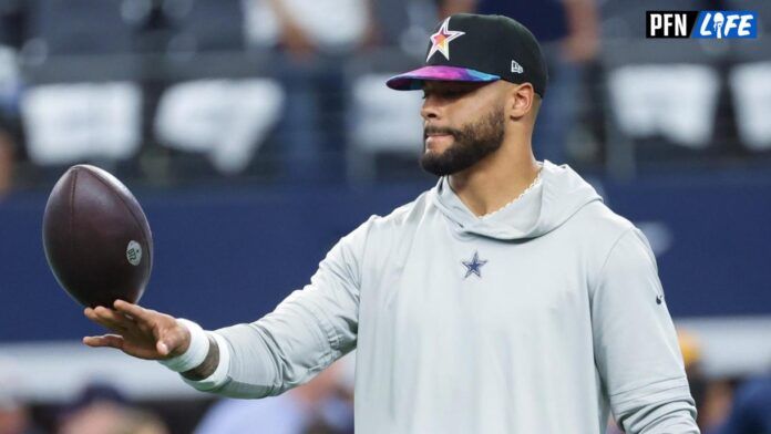 Dak Prescott (4) warms up before the game against the New England Patriots at AT&T Stadium.