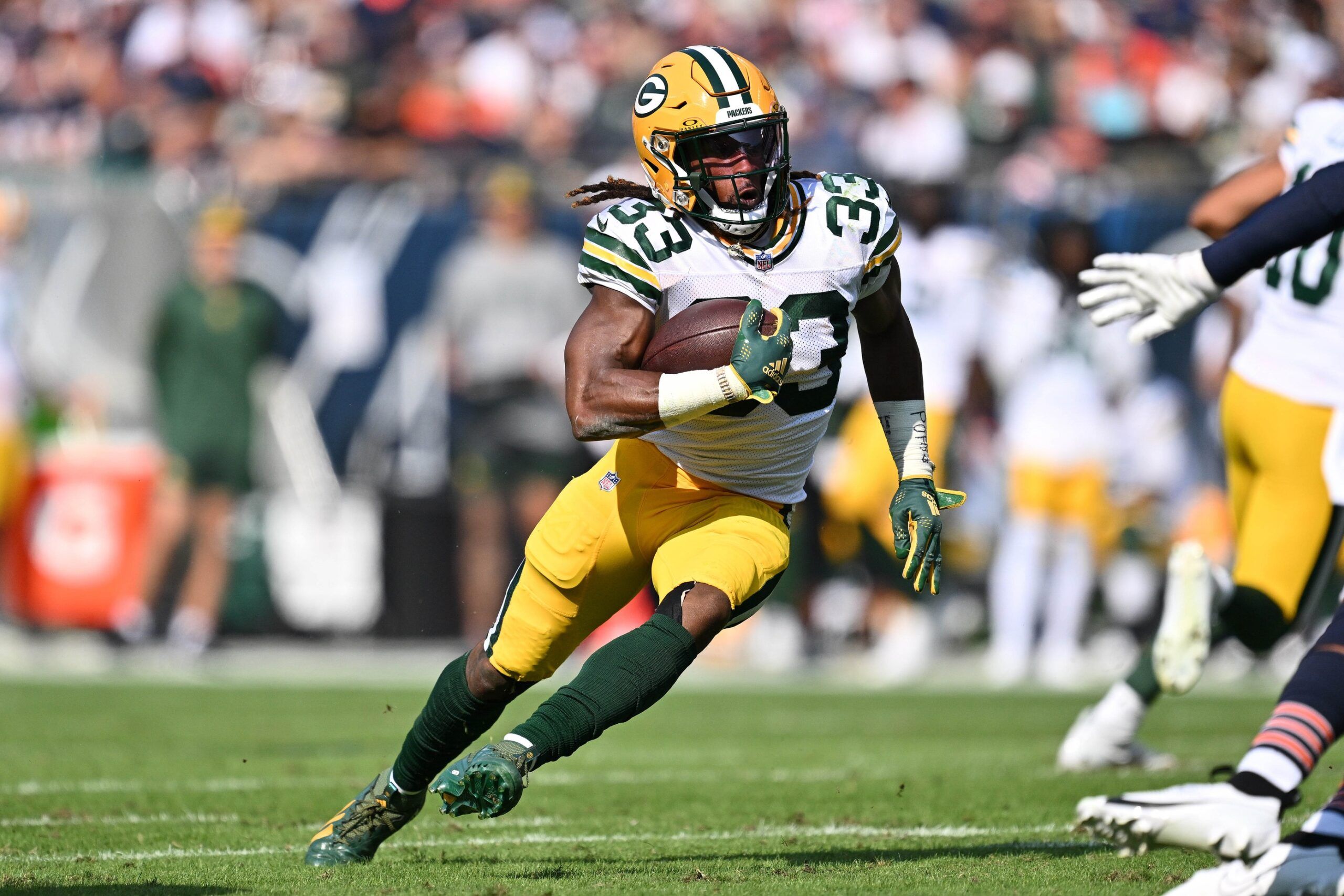 Aaron Jones (33) runs with the ball against the Chicago Bears at Soldier Field.