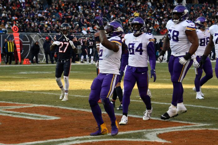 Minnesota Vikings running back Alexander Mattison (2) celebrates after he scores a touchdown against the Chicago Bears during the second half at Soldier Field.