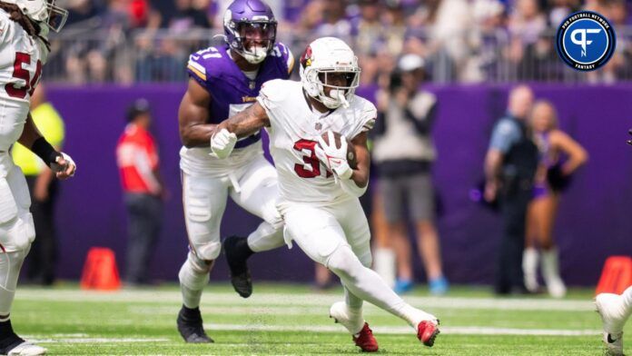 Emari Demercado (31) runs against the Minnesota Vikings in the second quarter at U.S. Bank Stadium.