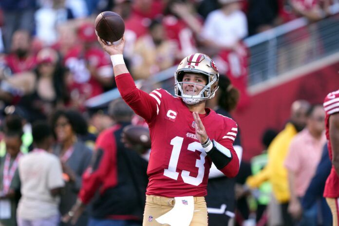 Brock Purdy (13) warms up before the game against the Dallas Cowboys at Levi's Stadium.