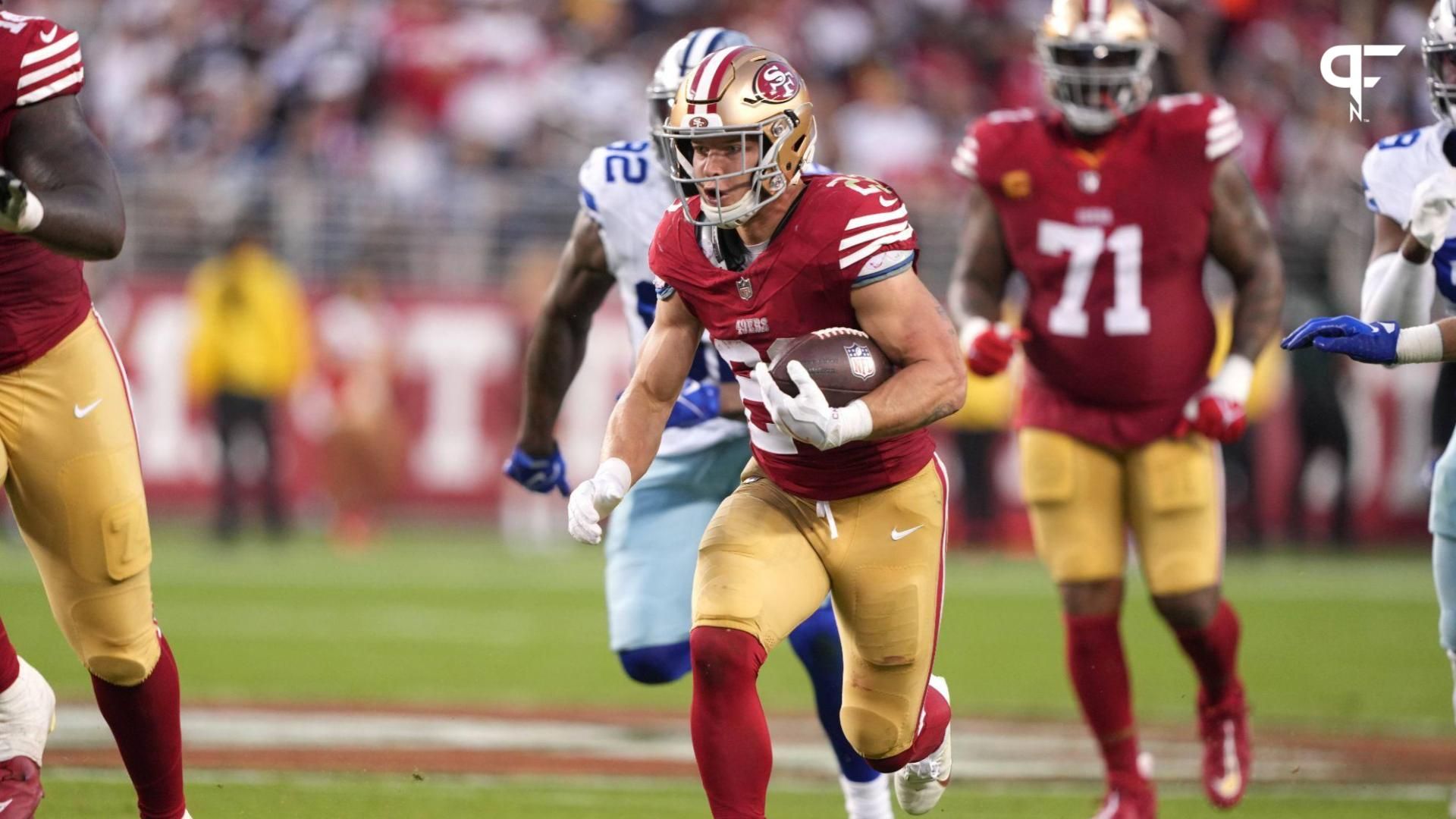 San Francisco 49ers running back Christian McCaffrey (center) carries the ball against the Dallas Cowboys during the second quarter at Levi's Stadium.