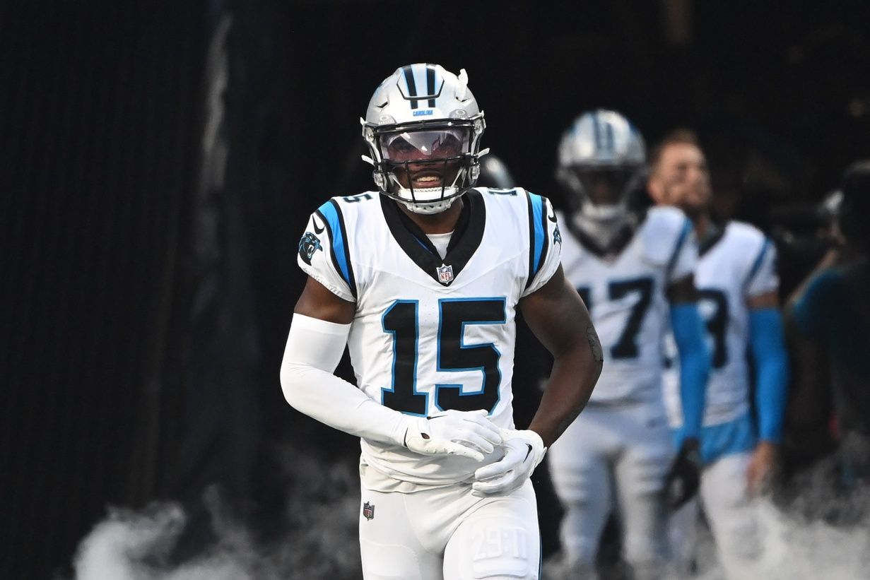 Jonathan Mingo (15) runs on to the field before the game at Bank of America Stadium.