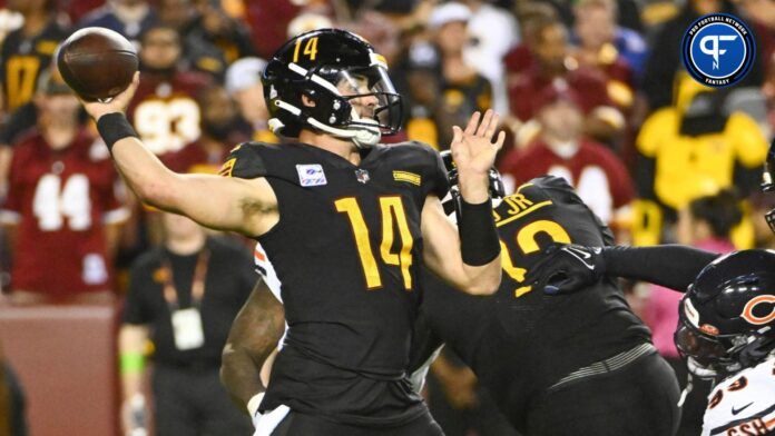 Sam Howell (14) attempts a pass against the Chicago Bears during the second half at FedExField.