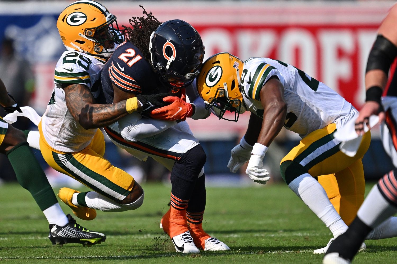 D'Onta Foreman (21) is brought down by Green Bay Packers cornerback Rasul Douglas (29) and safety Rudy Ford (20) in the first half at Soldier Field.