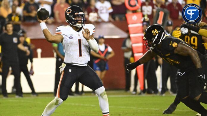 Justin Fields (1) throws over Washington Commanders defensive tackle Daron Payne (94) during the second half at FedExField.