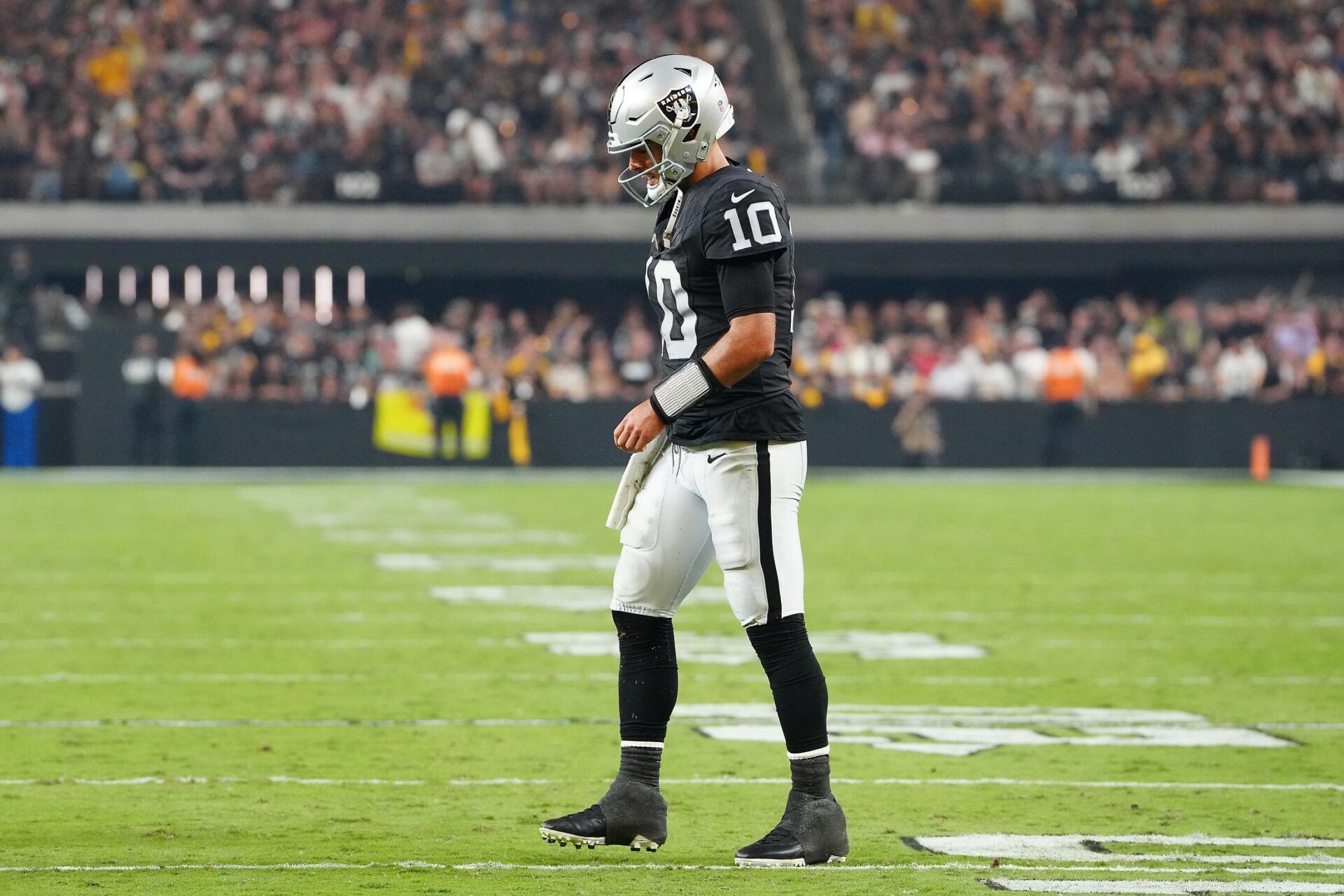 Jimmy Garoppolo (10) walks back to the huddle after being knocked to the ground by the Pittsburgh Steelers defense during the fourth quarter at Allegiant Stadium.