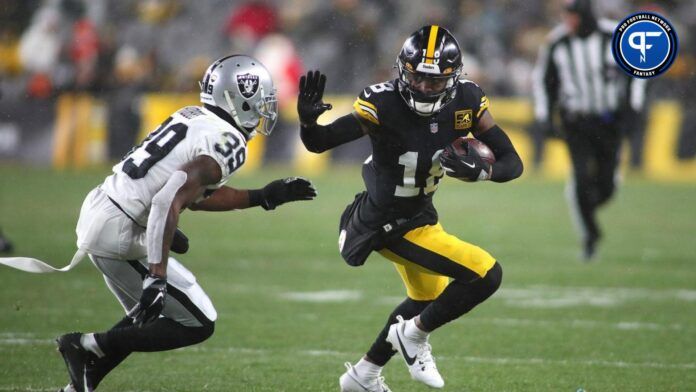 Pittsburgh Steelers Diontae Johnson (18) stiff arms Las Vegas Raiders Nate Hobbs (39) during the first half at Acrisure Stadium.