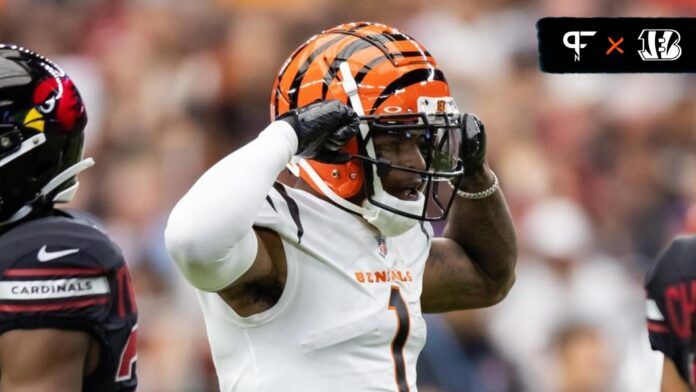 Ja'Marr Chase (1) flexes as he celebrates a first down against the Arizona Cardinals in the first half at State Farm Stadium.