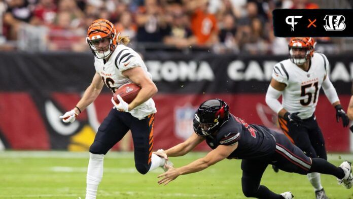 Cincinnati Bengals wide receiver Trenton Irwin (16) returns a kick against diving Arizona Cardinals long snapper Aaron Brewer.