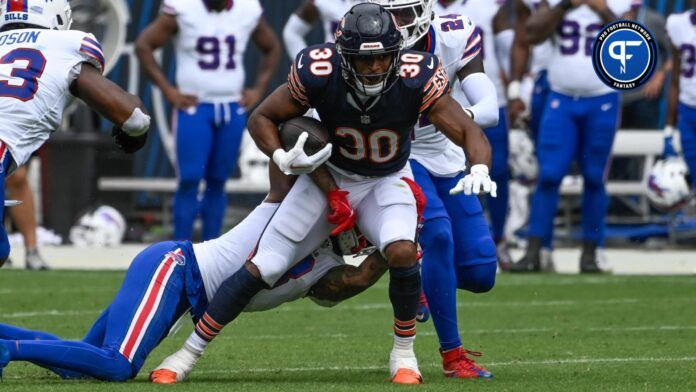 Chicago Bears running back Roschon Johnson (30) runs with the ball during the first half at Soldier Field.