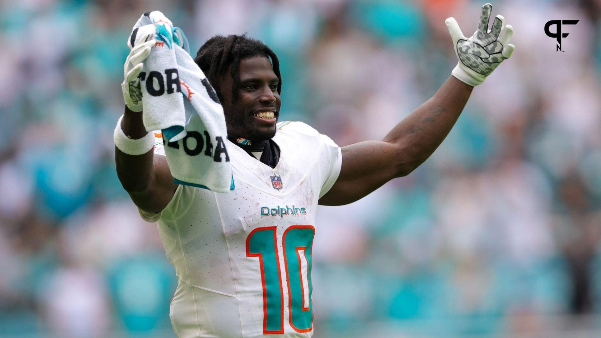 Miami Dolphins wide receiver Tyreek Hill (10) looks on from the sidelines against the Denver Broncos in the fourth quarter at Hard Rock Stadium.