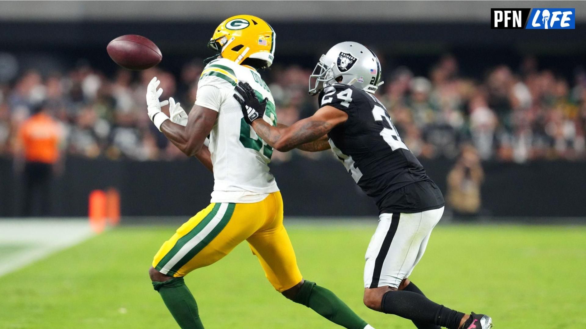 Green Bay Packers wide receiver Romeo Doubs (87) misses a pass as Las Vegas Raiders cornerback Marcus Peters (24) defends on the play.