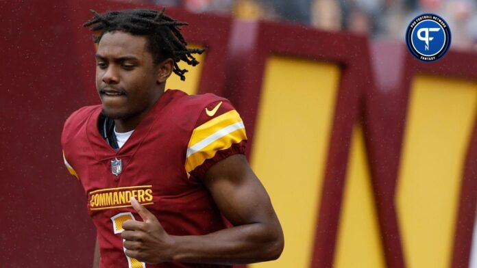 Washington Commanders wide receiver Jahan Dotson (1) runs onto the field during player introductions prior to the game against the Buffalo Bills at FedExField.