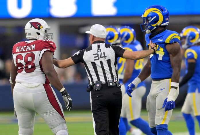 NFL referee Clete Blakeman (34) separates Arizona Cardinals offensive tackle Kelvin Beachum (68) and Los Angeles Rams linebacker Leonard Floyd (54) in the second half at SoFi Stadium.