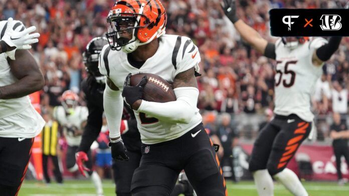 Cincinnati Bengals CB Cam Taylor-Britt (29) takes an interception for a touchdown.