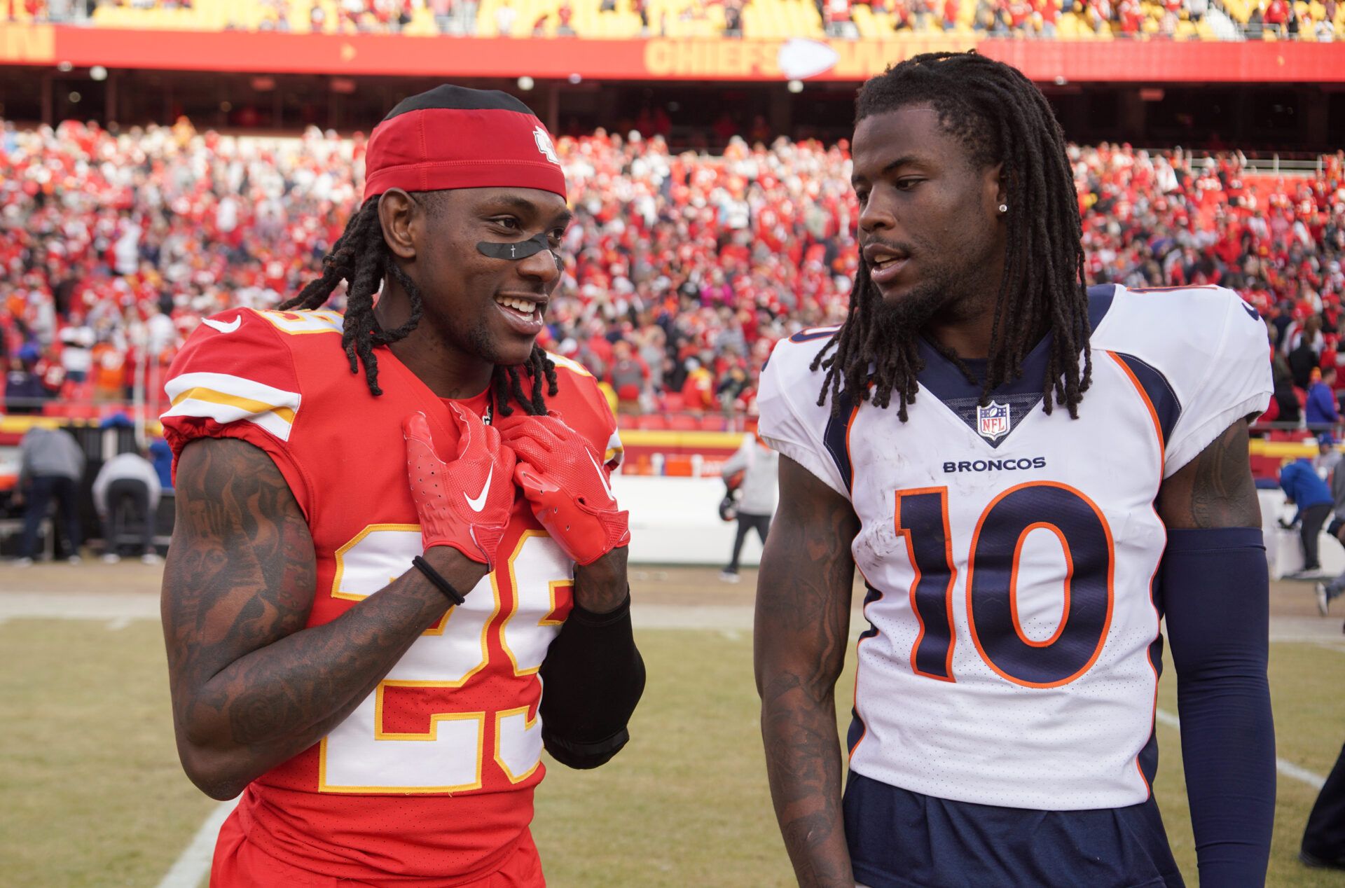 Kansas City Chiefs running back Clyde Edwards-Helaire (25) talks with Denver Broncos wide receiver Jerry Jeudy (10) on field after a game at GEHA Field at Arrowhead Stadium.