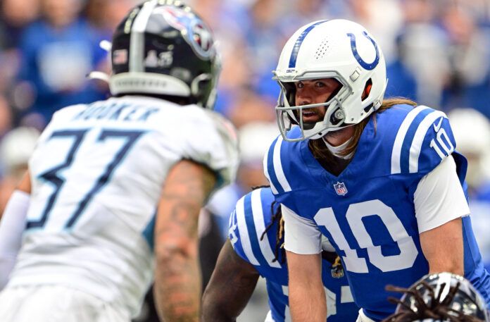 Indianapolis Colts quarterback Gardner Minshew (10) looks at Tennessee Titans safety Amani Hooker (37) before taking the snap during the second half at Lucas Oil Stadium.