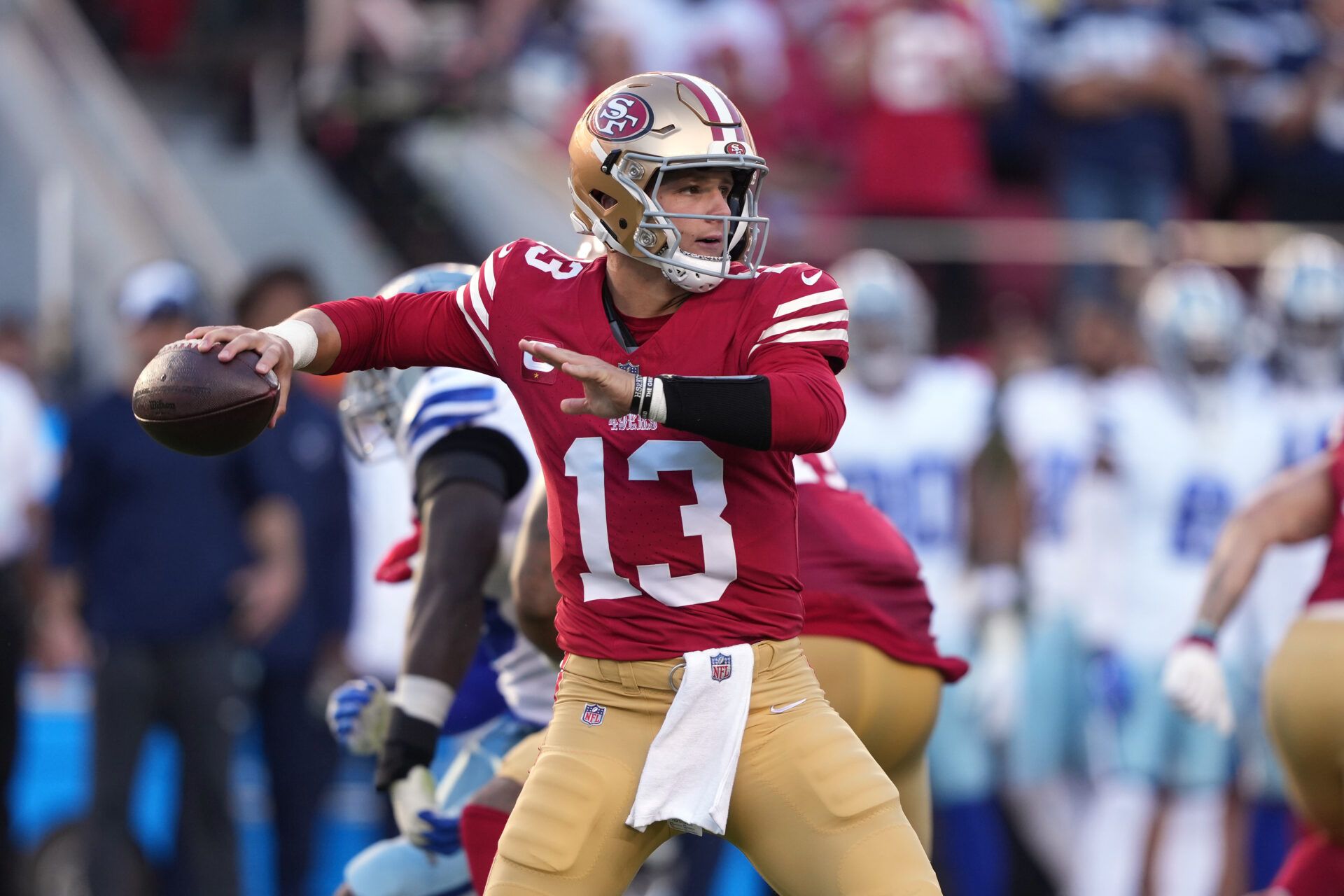 Oct 8, 2023; Santa Clara, California, USA; San Francisco 49ers quarterback Brock Purdy (13) throws a pass against the Dallas Cowboys during the first quarter at Levi's Stadium.