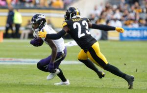 Baltimore Ravens wide receiver Zay Flowers (4) runs after a catch as Pittsburgh Steelers safety Damontae Kazee (23) defends during the second quarter at Acrisure Stadium.