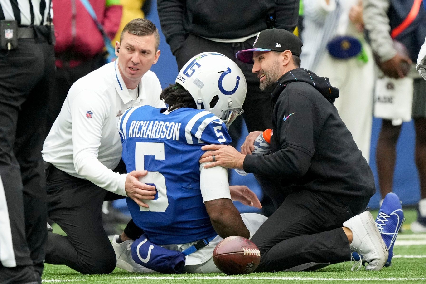 Indianapolis Colts personnel attends to QB Anthony Richardson (5) following an injury.