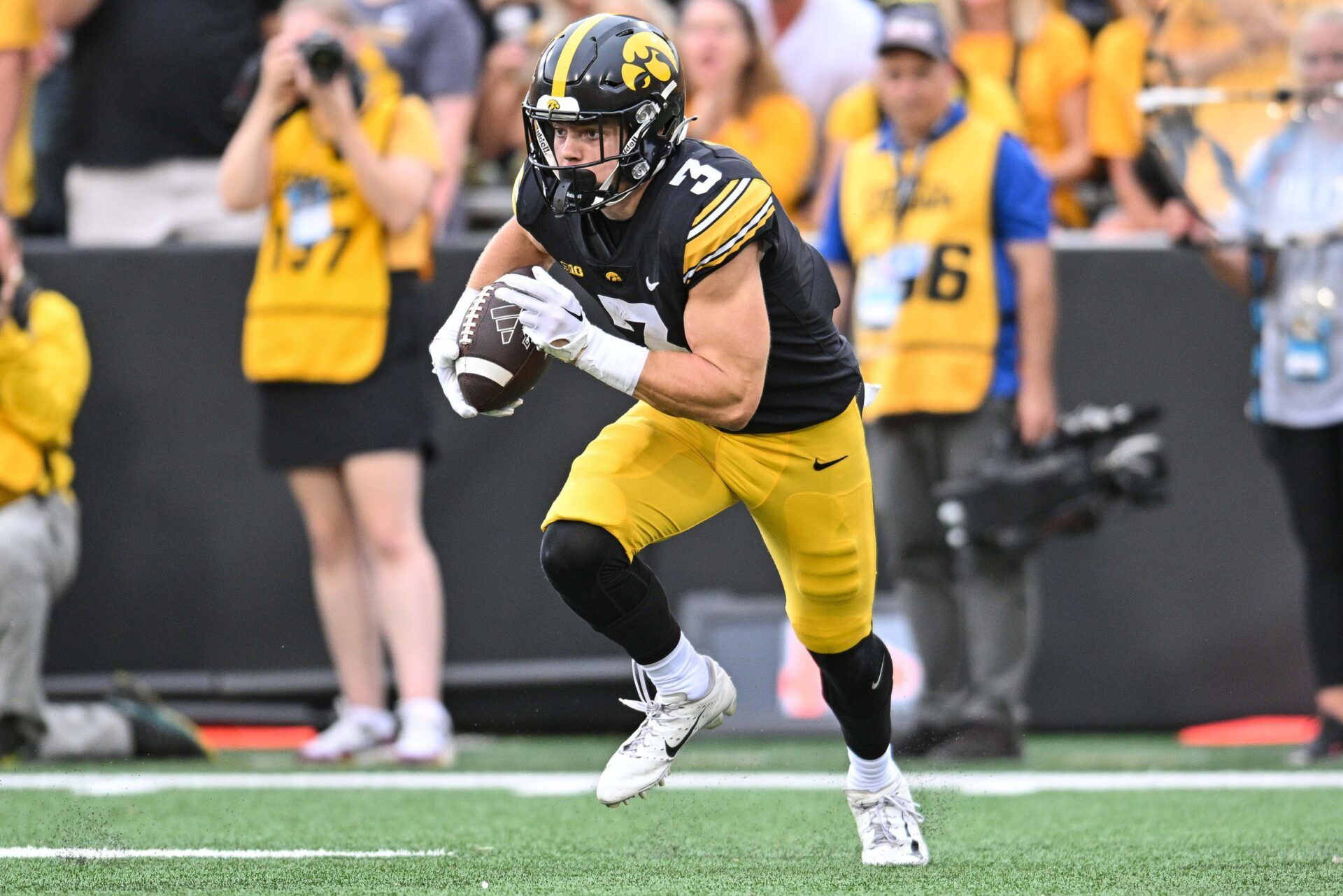 Iowa Hawkeyes defensive back Cooper DeJean (3) returns a punt against the Western Michigan Broncos during the second quarter at Kinnick Stadium.