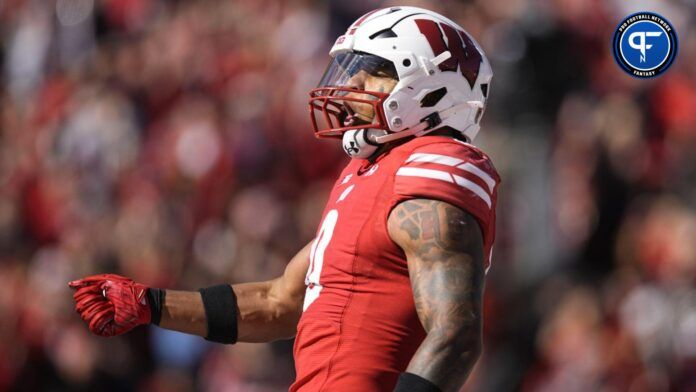 Braelon Allen (0) celebrates after scoring a touchdown during the second quarter against the Rutgers Scarlet Knights at Camp Randall Stadium.