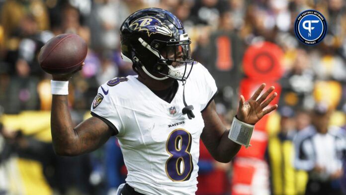 Lamar Jackson (8) passes the ball against the Pittsburgh Steelers during the first quarter at Acrisure Stadium.